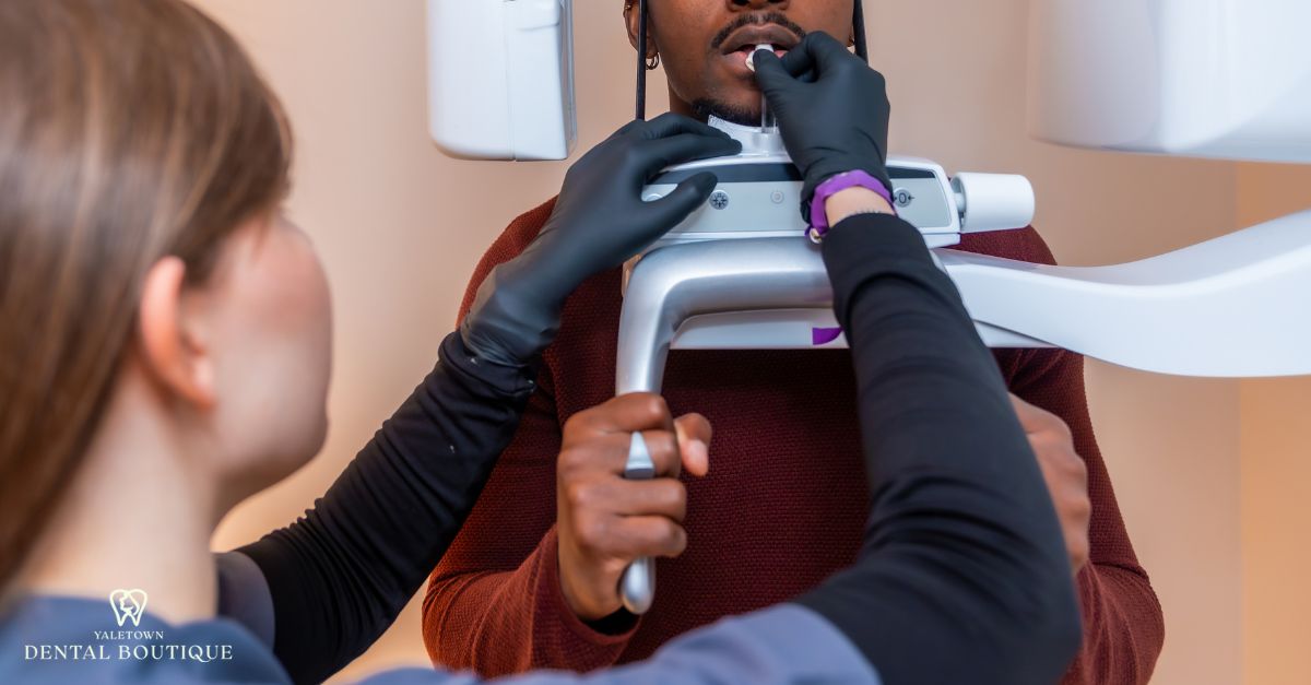Dental professional positioning a patient for a CBCT scan, demonstrating safe and precise imaging procedures