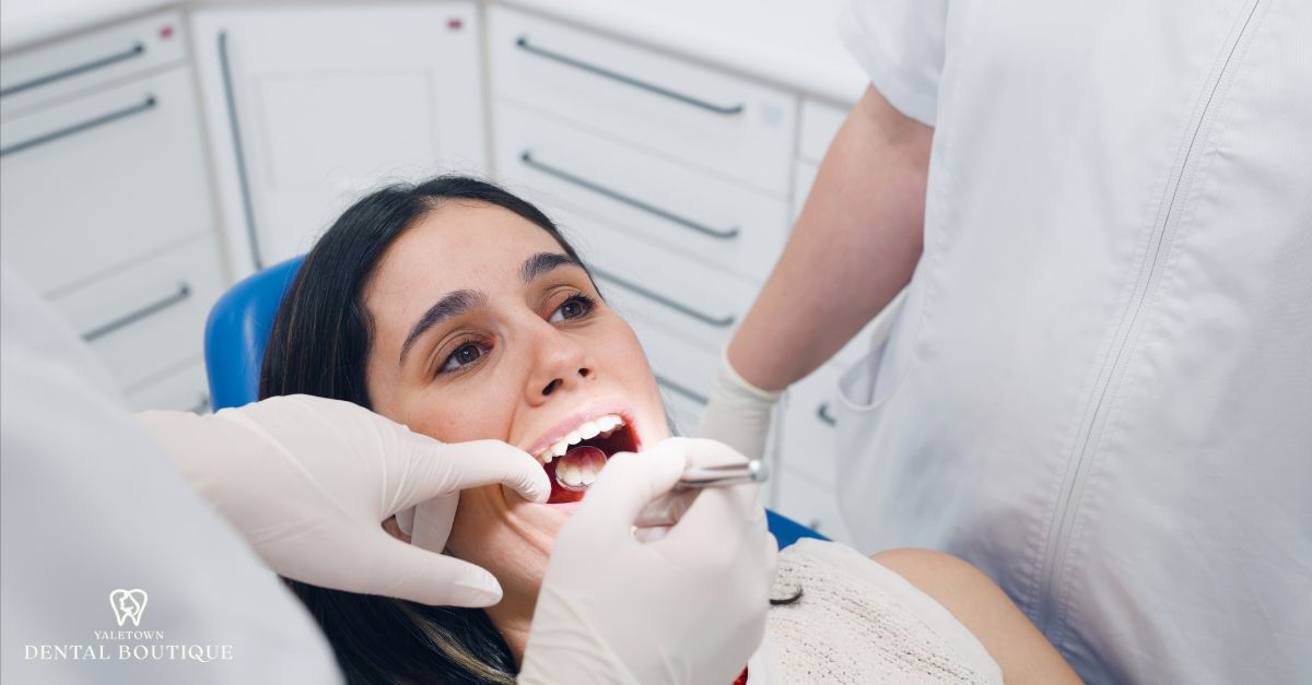Dental treatment showing when gingivitis needs professional care, with a dentist assessing gum health
