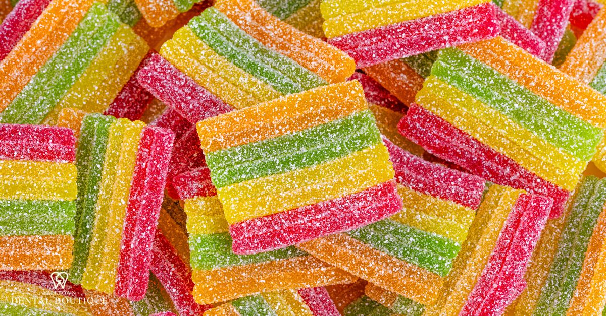 Frequent sugar intake from candies contributing to cavity risk
